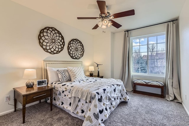 carpeted bedroom with a ceiling fan and baseboards