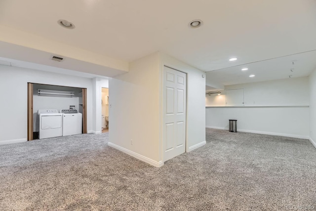 empty room with washing machine and dryer, recessed lighting, carpet flooring, and baseboards