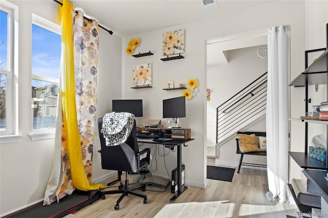 office space with light hardwood / wood-style flooring