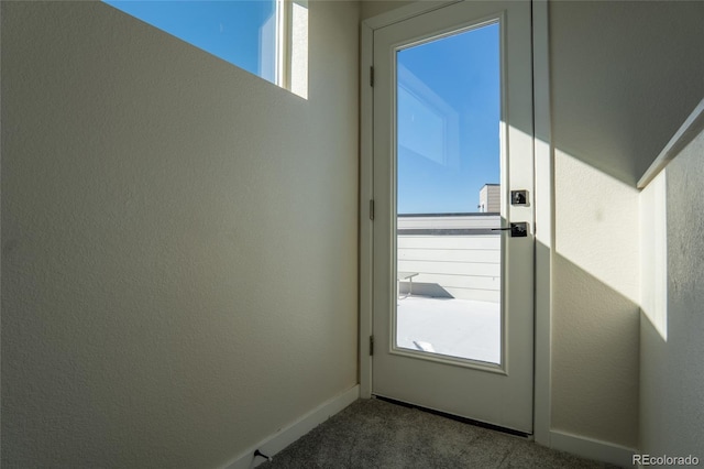 doorway to outside with carpet