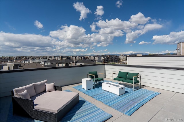 view of patio / terrace featuring an outdoor living space with a fire pit