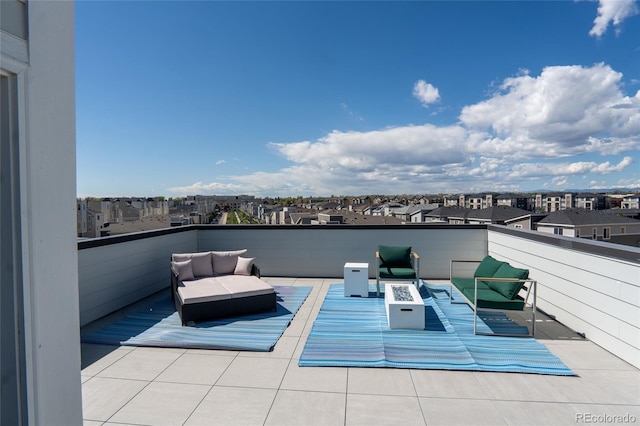 view of patio featuring an outdoor living space with a fire pit