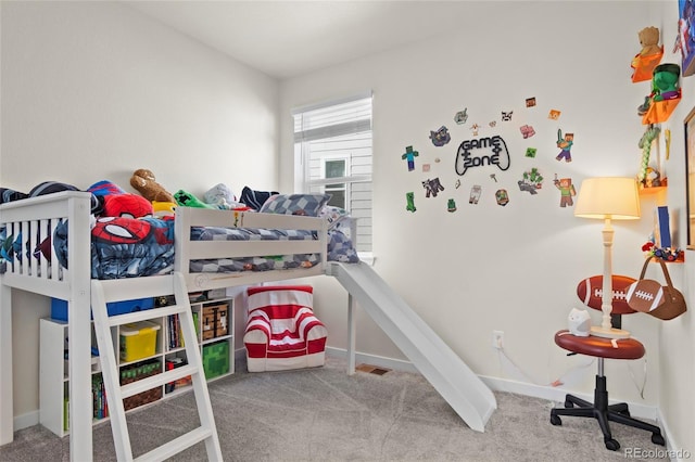 carpeted bedroom with baseboards