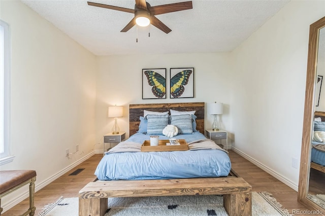 462 Chelan St, Golden, CO 80401 - bedroom with wood finished floors, baseboards, a textured ceiling, and ceiling fan