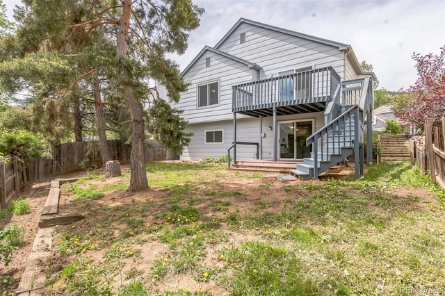 462 Chelan St, Golden, CO 80401 - rear view of property featuring a deck, a fenced backyard, and stairway
