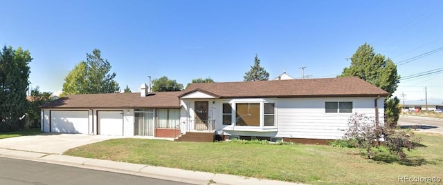 609 S 1st Ave, Brighton, CO 80601 - ranch-style home featuring a garage, concrete driveway, and a front lawn