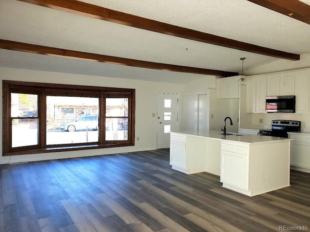 609 S 1st Ave, Brighton, CO 80601 - kitchen with stainless steel microwave, range with electric cooktop, a sink, beamed ceiling, and dark wood finished floors