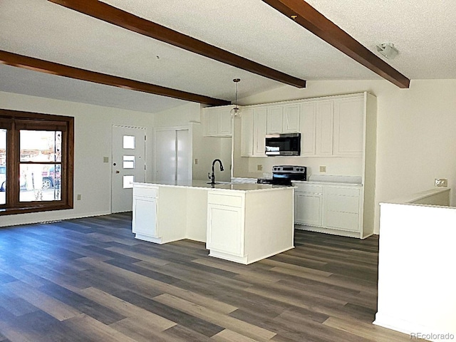 609 S 1st Ave, Brighton, CO 80601 - kitchen with stainless steel appliances, dark wood-style floors, white cabinetry, and a center island with sink
