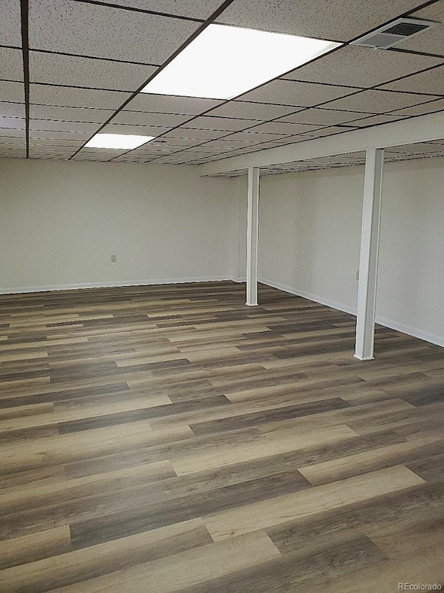 609 S 1st Ave, Brighton, CO 80601 - finished below grade area featuring wood finished floors and baseboards