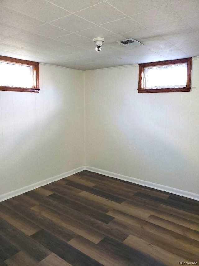 609 S 1st Ave, Brighton, CO 80601 - unfurnished room with dark wood-style flooring