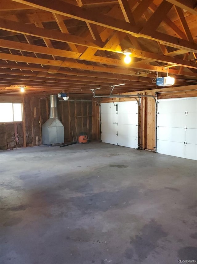 609 S 1st Ave, Brighton, CO 80601 - garage featuring a garage door opener