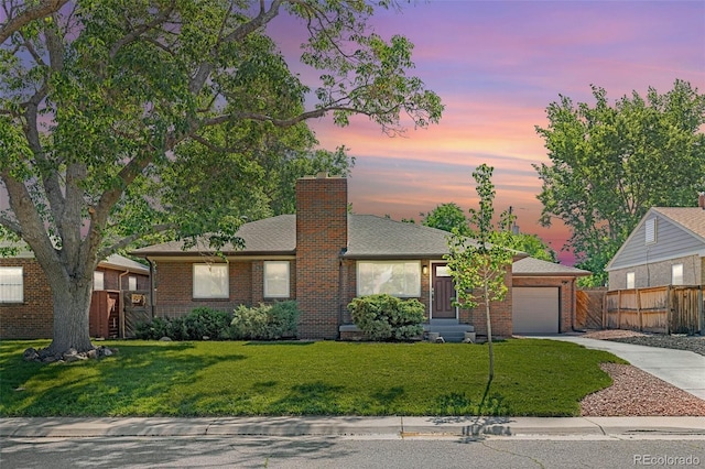 2880 N Glencoe St, Denver, CO 80207 - view of front of property featuring driveway, brick siding, a garage, and a chimney