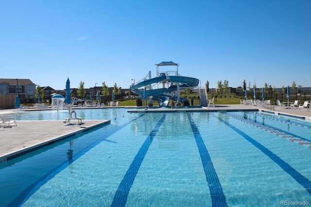 2880 N Glencoe St, Denver, CO 80207 - community pool featuring a water slide and a patio area