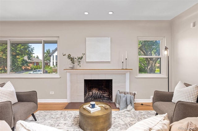 2880 N Glencoe St, Denver, CO 80207 - living area with plenty of natural light, recessed lighting, wood finished floors, and a fireplace