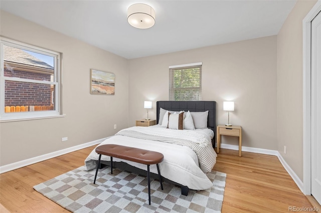 2880 N Glencoe St, Denver, CO 80207 - bedroom with light wood-style floors and baseboards