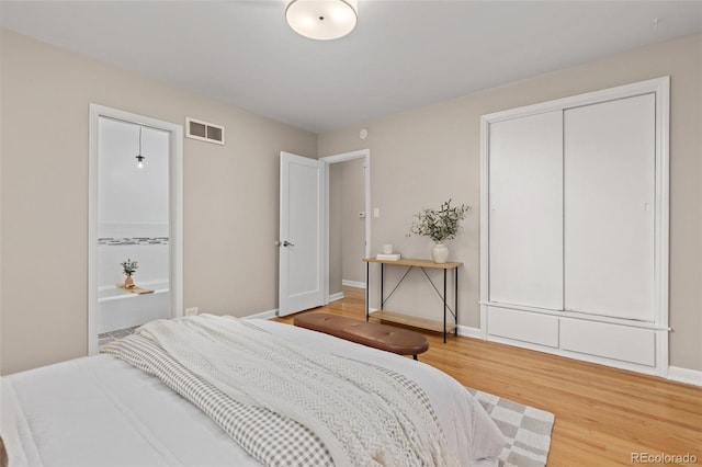 2880 N Glencoe St, Denver, CO 80207 - bedroom with light wood-style flooring and baseboards