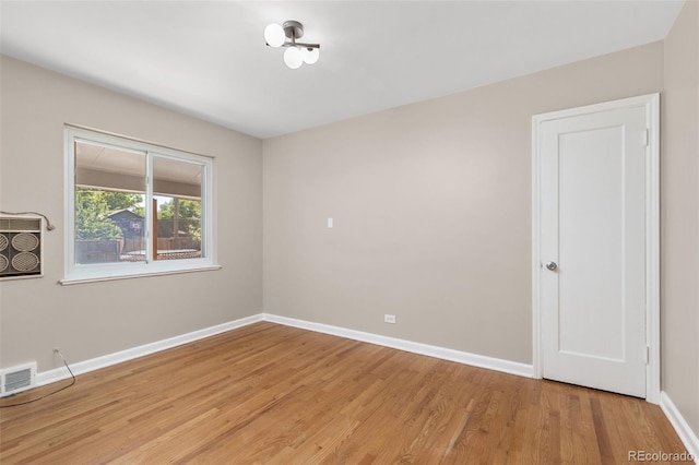 2880 N Glencoe St, Denver, CO 80207 - empty room with baseboards and light wood-style flooring