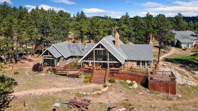 rear view of house with a deck