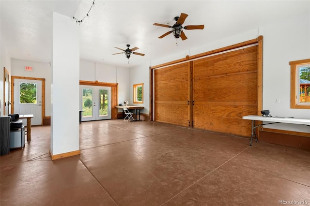 garage with ceiling fan and french doors