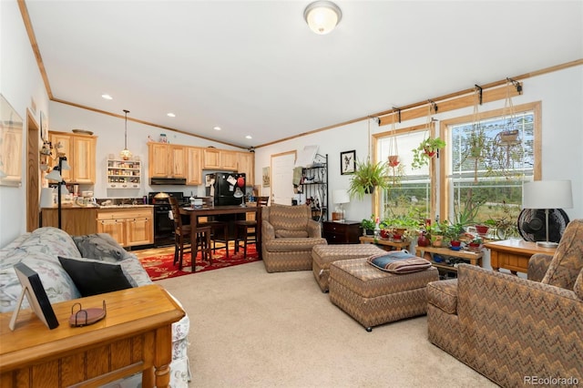 carpeted living room featuring lofted ceiling and ornamental molding