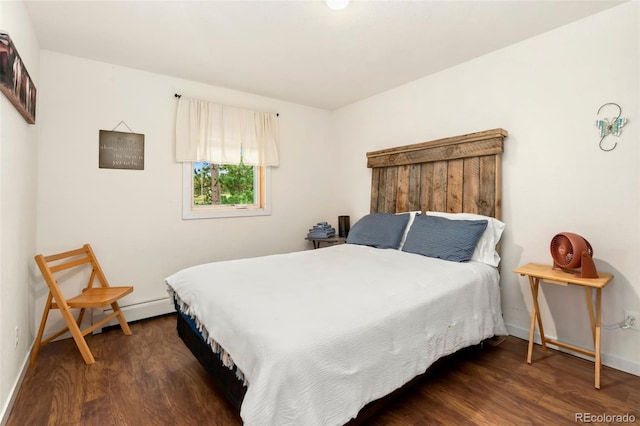 bedroom with dark hardwood / wood-style flooring