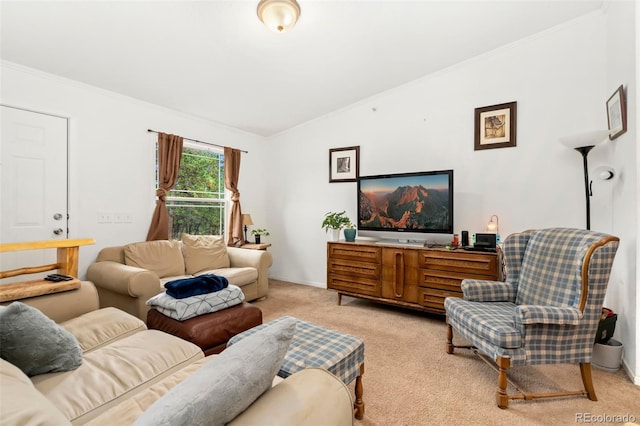 carpeted living room featuring crown molding