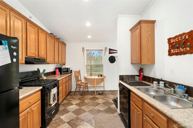 kitchen with ornamental molding, black appliances, and sink