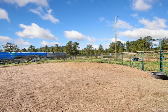 surrounding community with a rural view and an outdoor structure