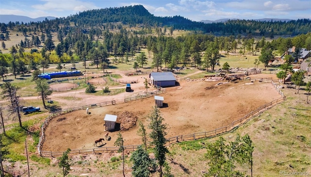 drone / aerial view featuring a mountain view and a rural view