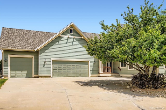 3525 Rinn Valley Dr, Longmont, CO 80504 - obstructed view of property with concrete driveway, a garage, and a shingled roof