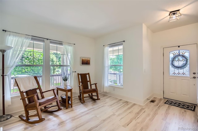 3525 Rinn Valley Dr, Longmont, CO 80504 - foyer featuring wood finished floors and baseboards