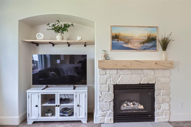 3525 Rinn Valley Dr, Longmont, CO 80504 - living area featuring baseboards and a stone fireplace