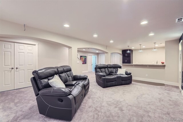 3525 Rinn Valley Dr, Longmont, CO 80504 - living room featuring arched walkways, carpet floors, and recessed lighting