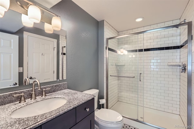 3525 Rinn Valley Dr, Longmont, CO 80504 - full bathroom featuring a shower stall, vanity, and a textured wall