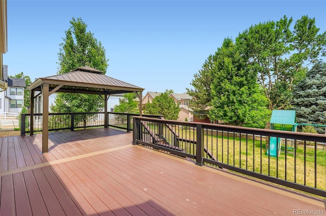 3525 Rinn Valley Dr, Longmont, CO 80504 - deck featuring a playground, a gazebo, and a lawn
