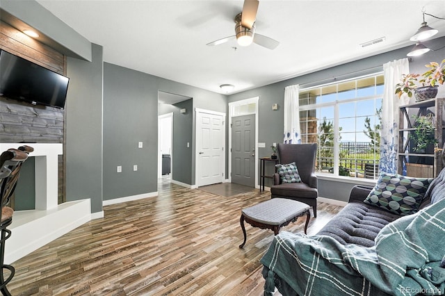 474 Black Feather Loop Unit 406, Castle Rock, CO 80104 - living area featuring wood finished floors and ceiling fan