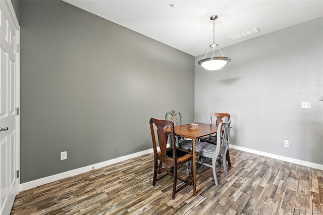 474 Black Feather Loop Unit 406, Castle Rock, CO 80104 - dining area with wood finished floors and baseboards