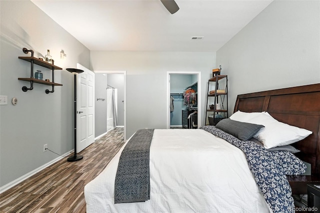 474 Black Feather Loop Unit 406, Castle Rock, CO 80104 - bedroom with dark wood-style flooring, a spacious closet, and ceiling fan