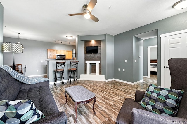474 Black Feather Loop Unit 406, Castle Rock, CO 80104 - living room with wood finished floors and a ceiling fan
