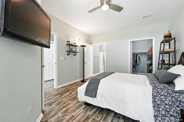 474 Black Feather Loop Unit 406, Castle Rock, CO 80104 - bedroom with wood finished floors, a spacious closet, and a closet