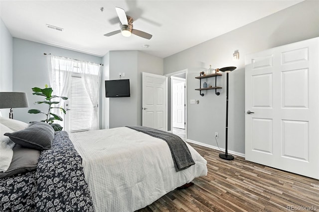 474 Black Feather Loop Unit 406, Castle Rock, CO 80104 - bedroom with dark wood-style flooring and a ceiling fan