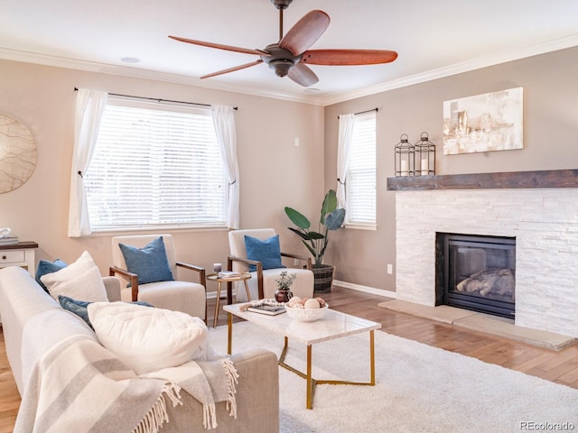 3472 Harvard Pl, Broomfield, CO 80023 - living room featuring wood finished floors, a ceiling fan, ornamental molding, baseboards, and a fireplace