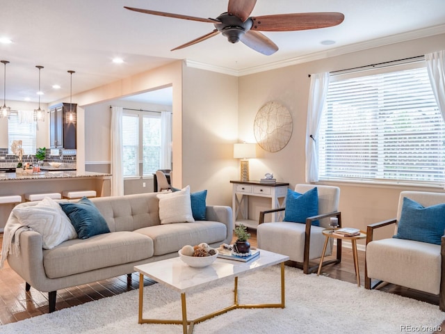 3472 Harvard Pl, Broomfield, CO 80023 - living area featuring light wood-type flooring, a ceiling fan, recessed lighting, ornamental molding, and baseboards