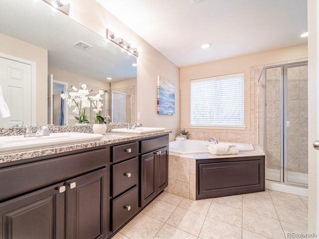 3472 Harvard Pl, Broomfield, CO 80023 - bathroom featuring double vanity, a shower stall, a garden tub, and tile patterned floors