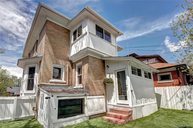 rear view of house with entry steps