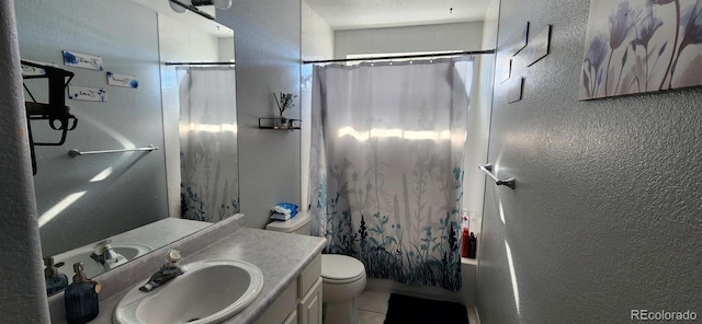 full bathroom with vanity, tile patterned flooring, toilet, and shower / tub combo with curtain