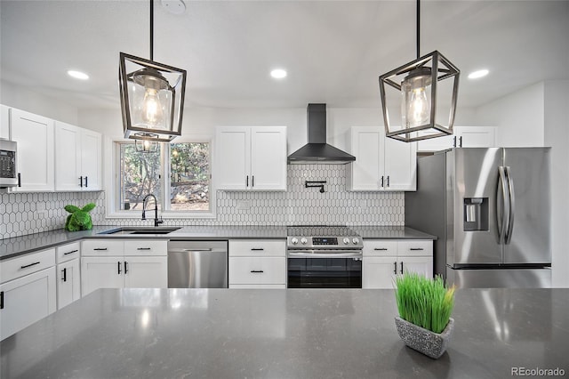 2020 Forest Ridge Dr, Colorado Springs, CO 80918 - kitchen with wall chimney range hood, white cabinets, a sink, stainless steel appliances, and backsplash