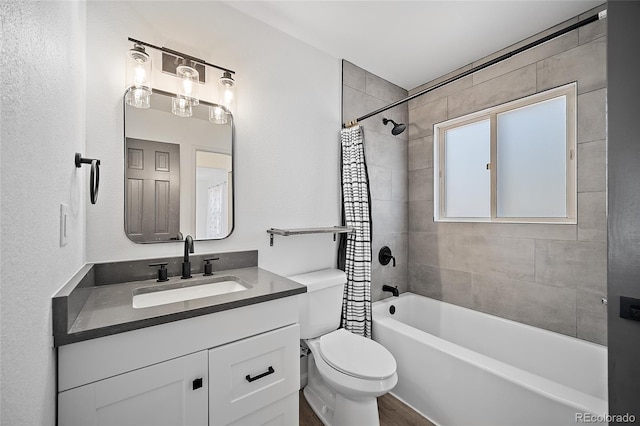 2020 Forest Ridge Dr, Colorado Springs, CO 80918 - bathroom with shower / tub combo, toilet, vanity, and wood finished floors