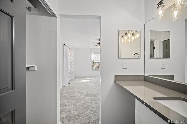 2020 Forest Ridge Dr, Colorado Springs, CO 80918 - bathroom with vanity and ceiling fan with notable chandelier