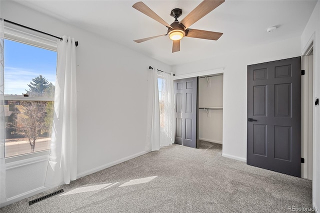 2020 Forest Ridge Dr, Colorado Springs, CO 80918 - unfurnished bedroom featuring a closet, baseboards, visible vents, ceiling fan, and carpet